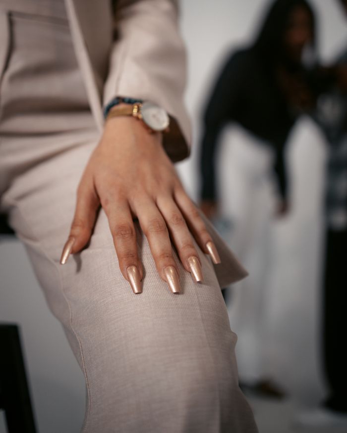 pexels photo 32782514 Close-up of a stylish hand pose showcasing fashion and elegance in a studio setting.